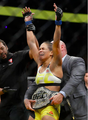 Amanda Nunes celebrates after defeating Miesha Tate in their women's bantamweight championship mixed martial arts bout at UFC 200 in Las Vegas. Ronda Rousey will return to the UFC on Dec. 30 in Las Vegas, fighting Nunes for the bantamweight title. (AP Photo/John Locher, File)