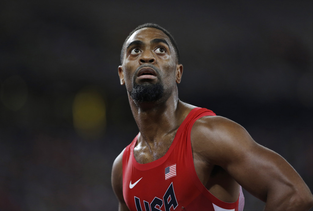In this Aug. 23, 2015, file photo, United States' Tyson Gay looks at his time from a men's 100-meter semifinal at the World Athletics Championships at the Bird's Nest stadium in Beijing. The 15-year-old daughter of Olympic sprinter Tyson Gay has been fatally shot in Kentucky, the athlete's agent and authorities said Sunday, Oct. 16, 2016. Trinity Gay died at the University of Kentucky Medical Center, the coroner's office for Fayette County said in a statement.  (AP Photo/David J. Phillip, File)