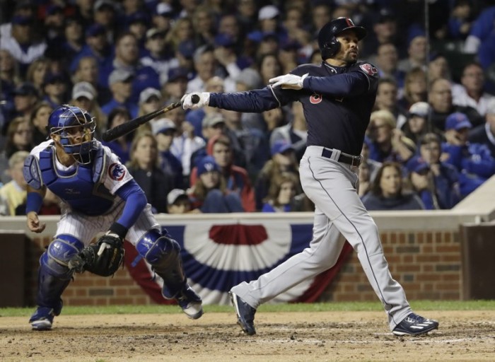 Cleveland Indians' Coco Crisp hits an RBI single during the seventh inning of Game 3 of the Major League Baseball World Series against the Chicago Cubs Friday, Oct. 28, 2016, in Chicago. AP