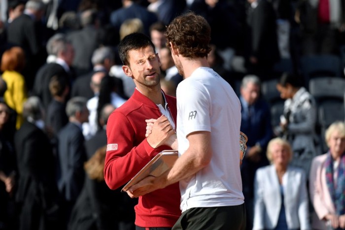 Winner Serbia's Novak Djokovic shakes hands with Britain's Andy Murray after the men's final match at the Roland Garros 2016 French Tennis Open in Paris on June 5, 2016. / AFP PHOTO / PHILIPPE LOPEZ