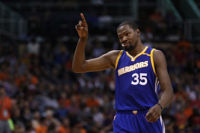 PHOENIX, AZ - OCTOBER 30: Kevin Durant #35 of the Golden State Warriors reacts after scoring against the Phoenix Suns during the second half of the NBA game at Talking Stick Resort Arena on October 30, 2016 in Phoenix, Arizona. The Warriors defeated the Suns, 106 -100. Christian Petersen/Getty Images/AFP