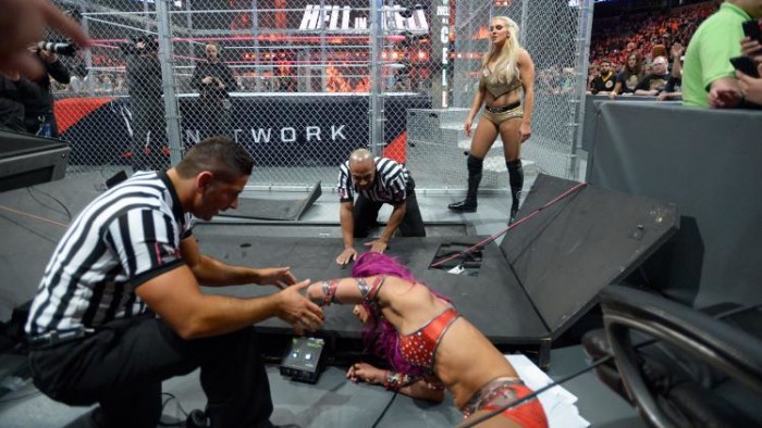 Charlotte and Sasha Banks fought in a historic Hell in a Cell match for the Raw Women's Championship. Photo by WWE.com