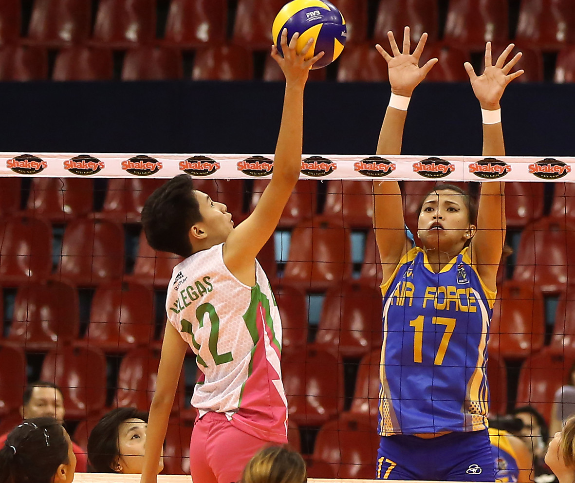 Laoag's Kath Villegas (left) goes for a tip as she goes up against Air Force’s lone blocker in Jocemer Tapic during their Shakey's V League Season 13 Reinforced Conference clash at the Philsports Arena. CONTRIBUTED PHOTO
