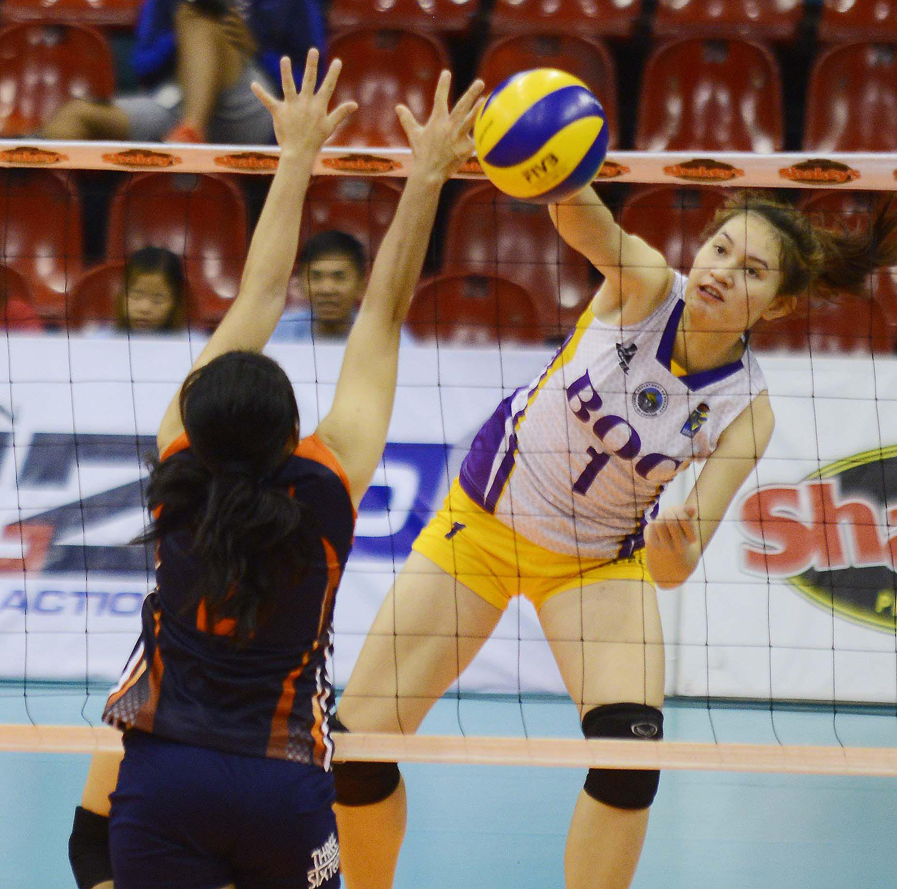 Thai Kanjana Kuthaisong fires away a kill against Coast Guard’s Sheila Marie Cecilio during their Shakey’s V-League Reinforced Conference duel at the Philsports Arena.