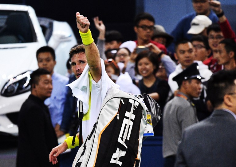 Mischa Zverev of Germany leaves after loosing against Novak Djokovic of Serbia in their men's singles match at the Shanghai Masters tennis tournament on October 14, 2016. / AFP PHOTO / JOHANNES EISELE