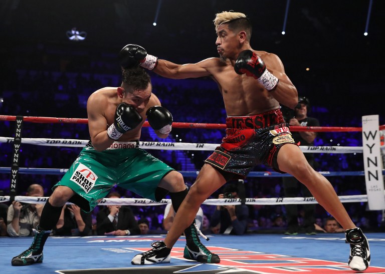 Jessie Magdaleno lands a right to the head of opponent Nonito Donaire of the Philippines during their WBO junior featherweight championship fight at the Thomas & Mack Center on November 5, 2016 in Las Vegas, Nevada.   Christian Petersen/Getty Images/AFP