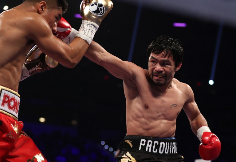 Manny Pacquiao of the Philippines lands a right to the head of Jessie Vargas during their WBO welterweight championship fight at the Thomas & Mack Center on November 5, 2016 in Las Vegas, Nevada.   Christian Petersen/Getty Images/AFP
