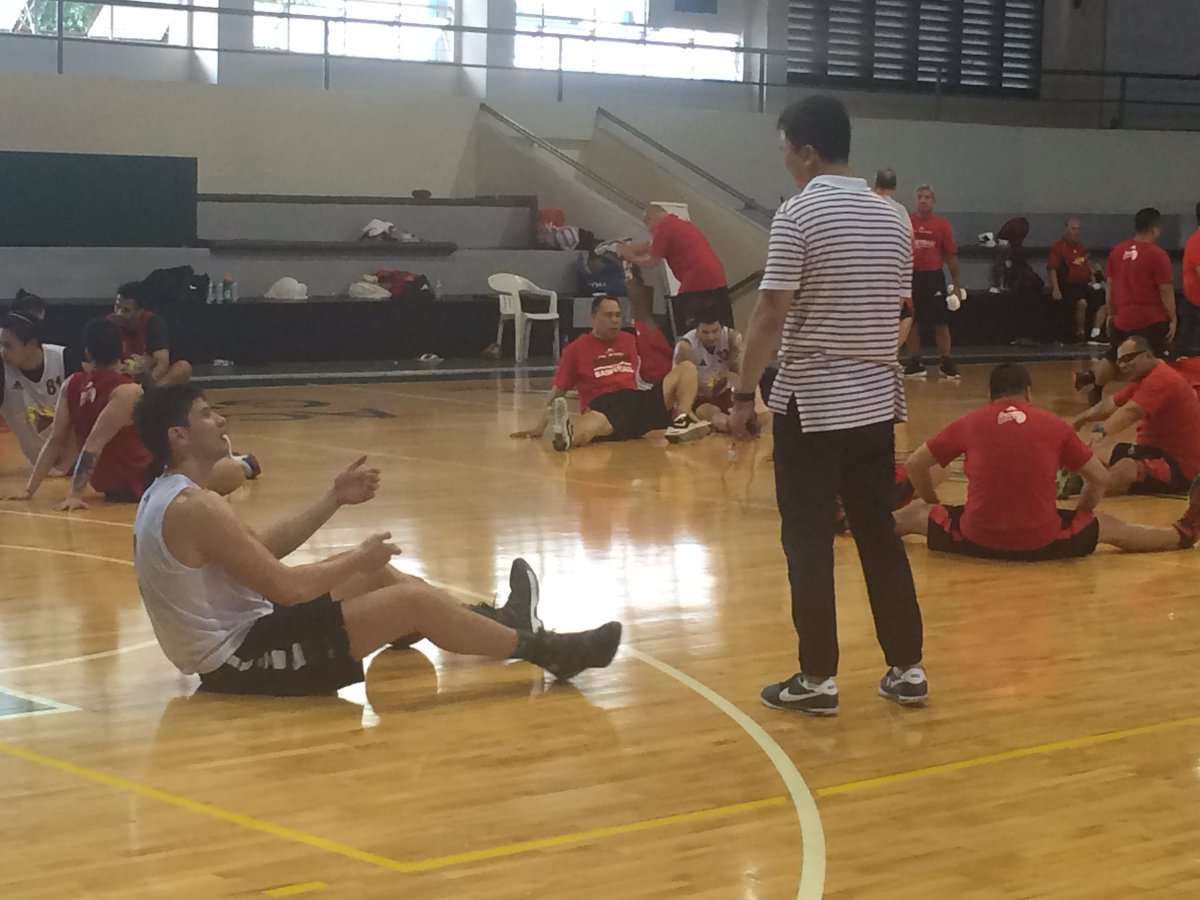 Arnold Van Opstal chats with his former coach and now San Miguel team manager Gee Abanilla.