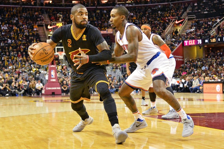 CLEVELAND, OH - OCTOBER 25: Kyrie Irving #2 of the Cleveland Cavaliers is defended by Brandon Jennings #3 of the New York Knicks as he looks to the basket in the third quarter on October 25, 2016 at Quicken Loans Arena in Cleveland, Ohio. Cleveland defeated New York 117-88. NOTE TO USER: User expressly acknowledges and agrees that, by downloading and or using this photograph, User is consenting to the terms and conditions of the Getty Images License Agreement.   Jamie Sabau/Getty Images/AFP