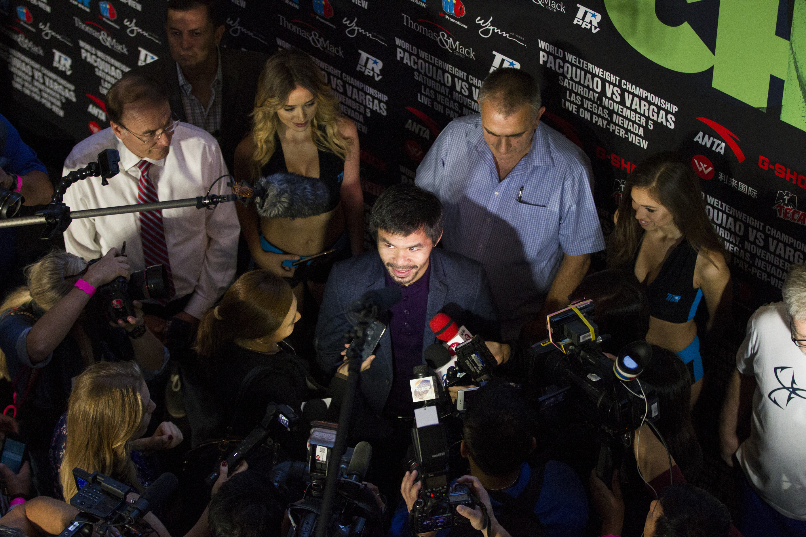 Boxer Manny Pacquiao is interviewed during his "Grand Arrival" to the Wynn hotel-casino on Tuesday, Nov. 1, 2016, in Las Vegas. Pacquiao is scheduled to fight Jessie Vargas on Saturday night at the Thomas & Mack Center. (Erik Verduzco/Las Vegas Review-Journal via AP