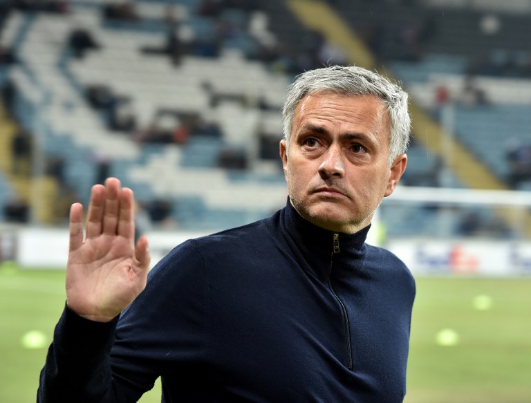 Manchester United FC coach Jose Mourinho greets the fans prior the UEFA Europa League football match between FC Zorya Luhansk and Manchester United FC at the Chornomorets stadium in Odessa on December 8, 2016. / AFP PHOTO / SERGEI SUPINSKY