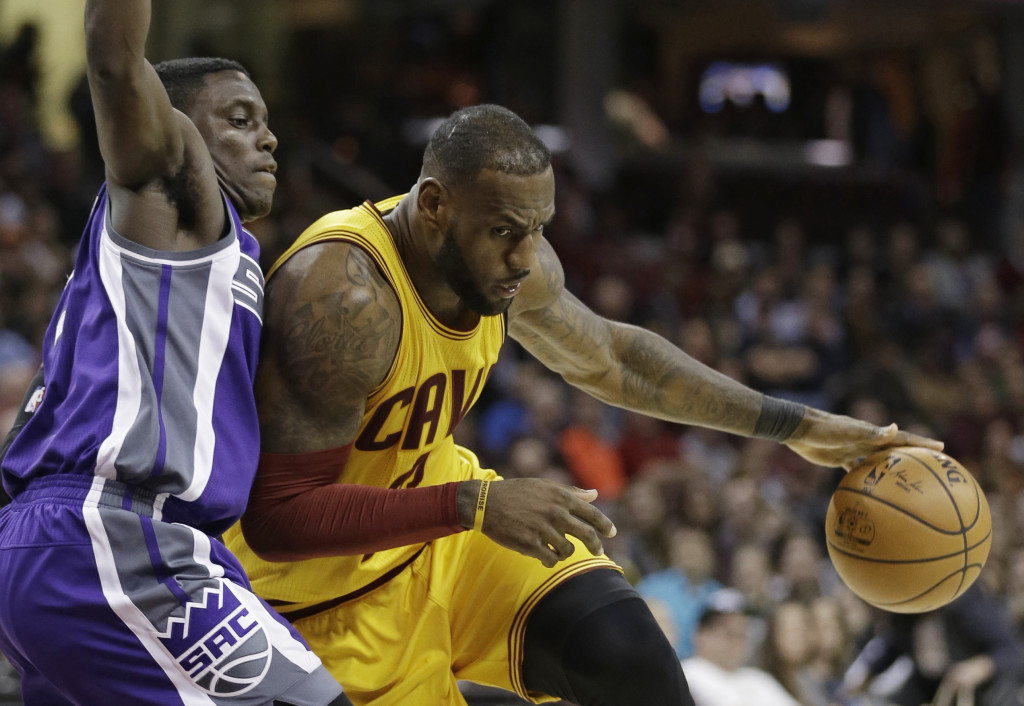 Cleveland Cavaliers' LeBron James, right, drives against Sacramento Kings' Darren Collison during the second half of an NBA basketball game, Wednesday, Jan. 25, 2017, in Cleveland. The Kings won 116-112 in overtime. (AP Photo/Tony Dejak)