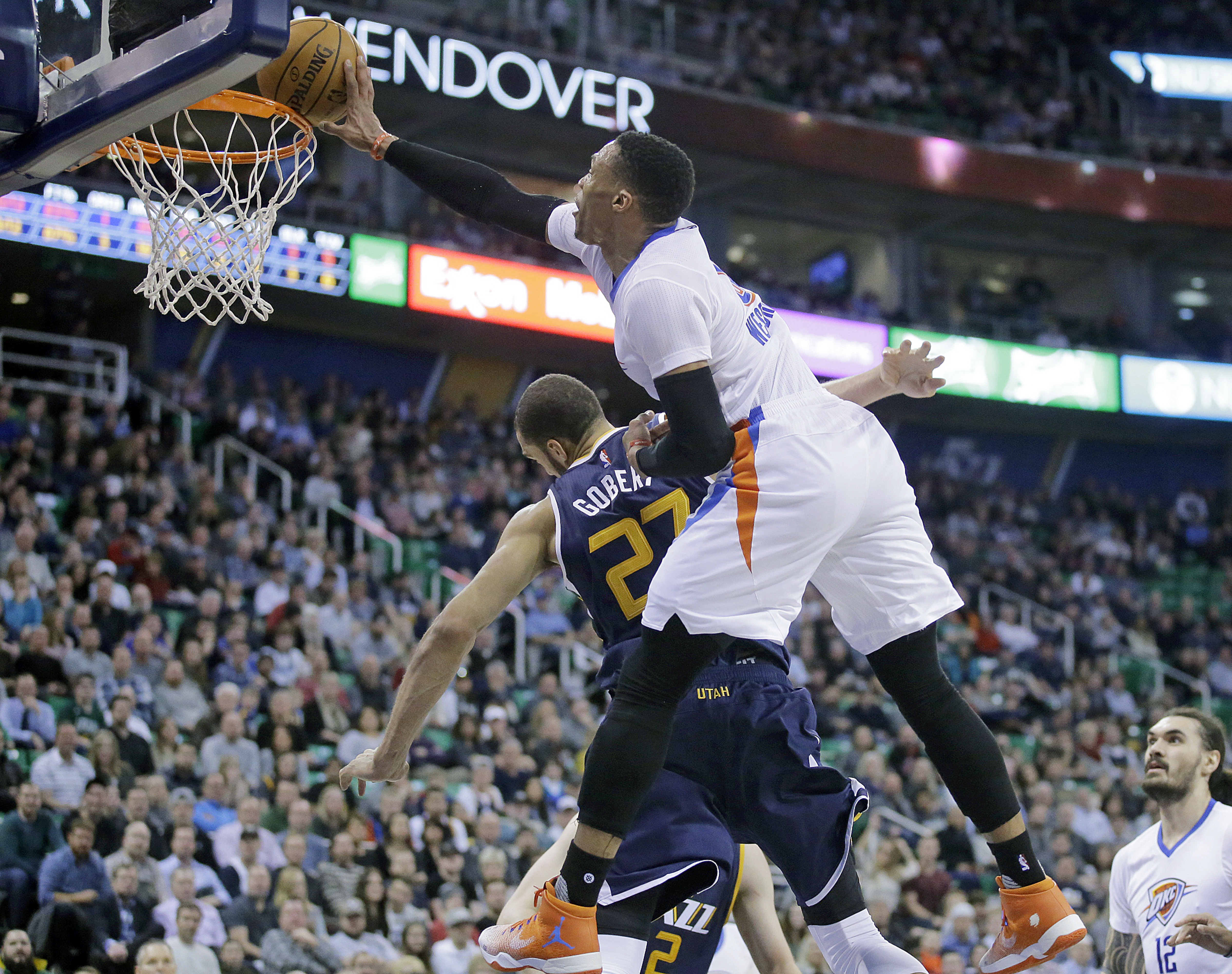 Oklahoma City Thunder guard Russell Westbrook (0) goes to the basket as Utah Jazz center Rudy Gobert (27) defends in the second quarter during a NBA basketball game Monday, Jan. 23, 2017, in Salt Lake City. (AP Photo/Rick Bowmer)