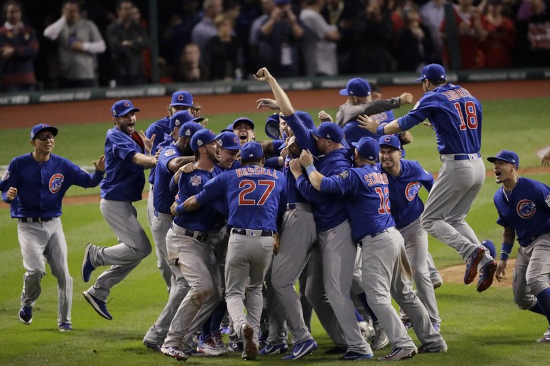 FILE - In this Nov. 3, 2016, file photo, the Chicago Cubs celebrate after Game 7 of the Major League Baseball World Series against the Cleveland Indians, in Cleveland. The Cubs won 8-7 in 10 innings to win the series 4 games to 3. AP