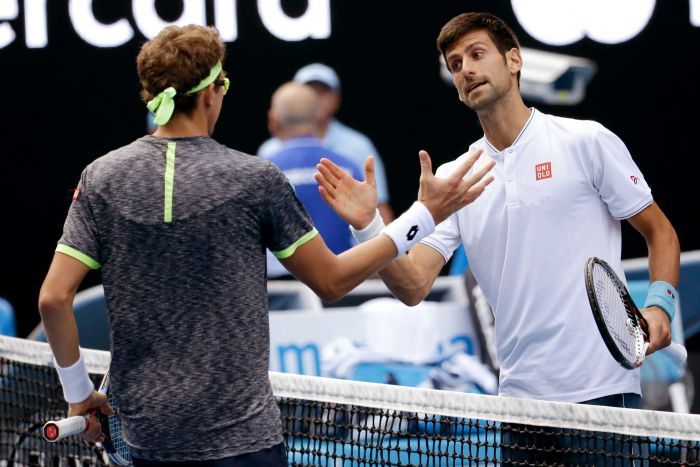 Novak Djokovic, right, congratulates Uzbekistan's Denis Istomin after their Australian Open match. AP
