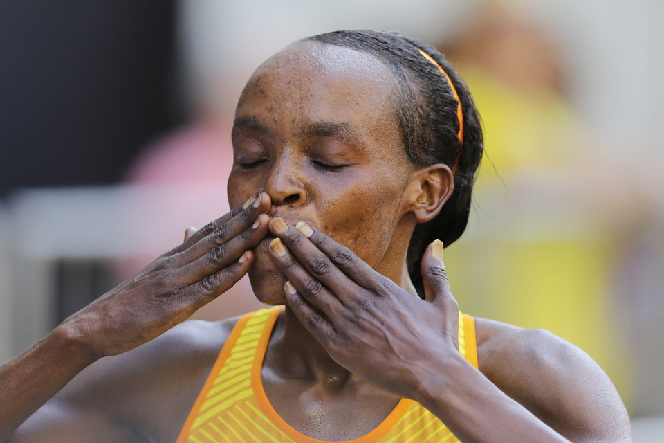 Kenya's Jemima Jelagat Sumgong blows a kiss after crossing the finish line and win the Sao Silvestre women's race in Sao Paulo, Brazil, Saturday, Dec. 31, 2016. The 15-kilometer race is held annually on New Year's Eve. AP