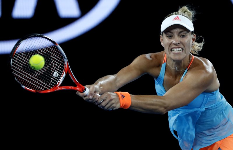 Germany's Angelique Kerber makes a backhand return to United States' Coco Vandeweghe during their fourth round match at the Australian Open tennis championships in Melbourne, Australia, Sunday, Jan. 22, 2017. AP