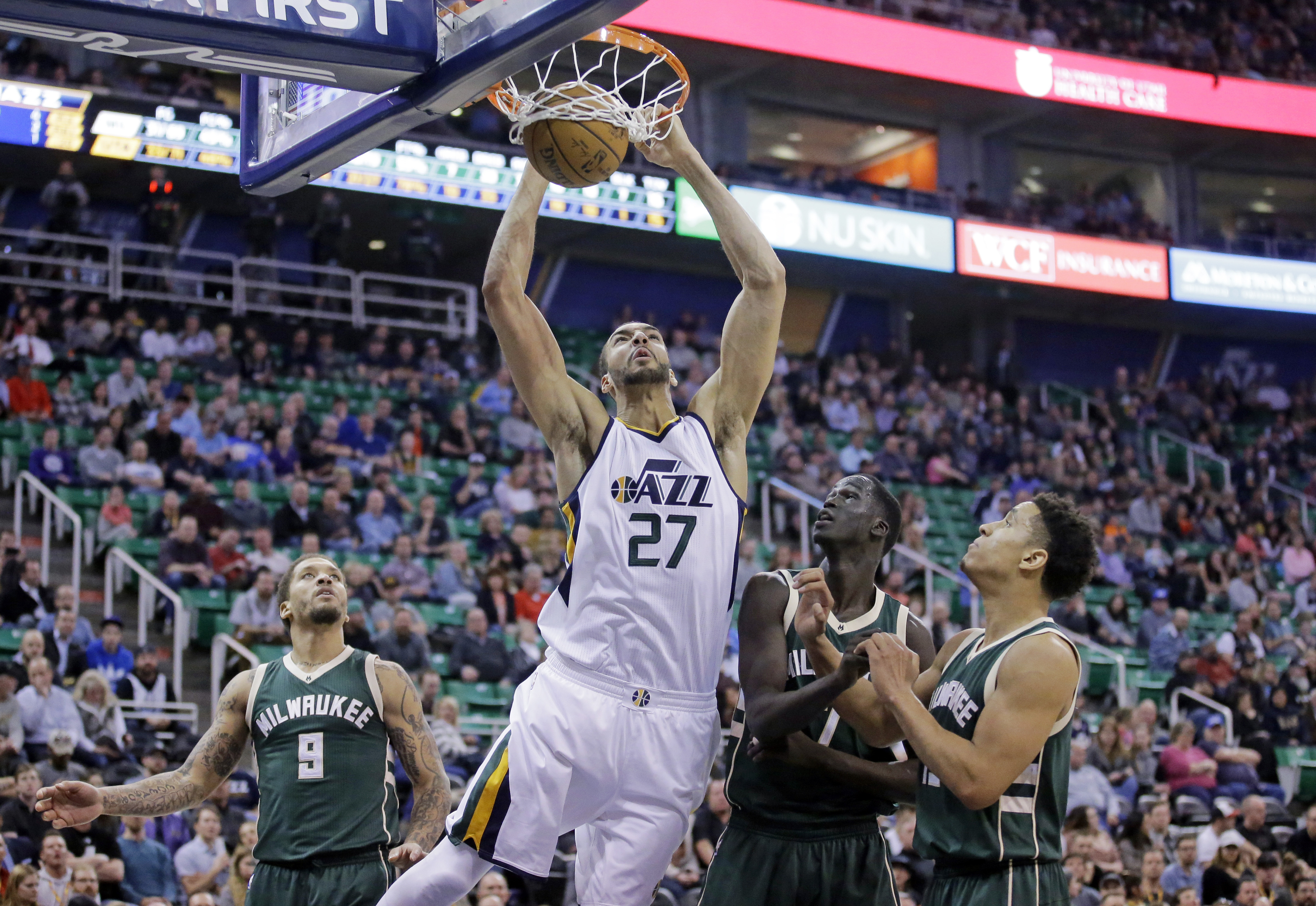 Utah Jazz center Rudy Gobert (27) dunks the ball as Milwaukee Bucks' Michael Beasley (9), Thon Maker, second from right, and Malcolm Brogdon, right, look on in the second half during an NBA basketball game, Wednesday, Feb. 1, 2017, in Salt Lake City. (AP Photo/Rick Bowmer)