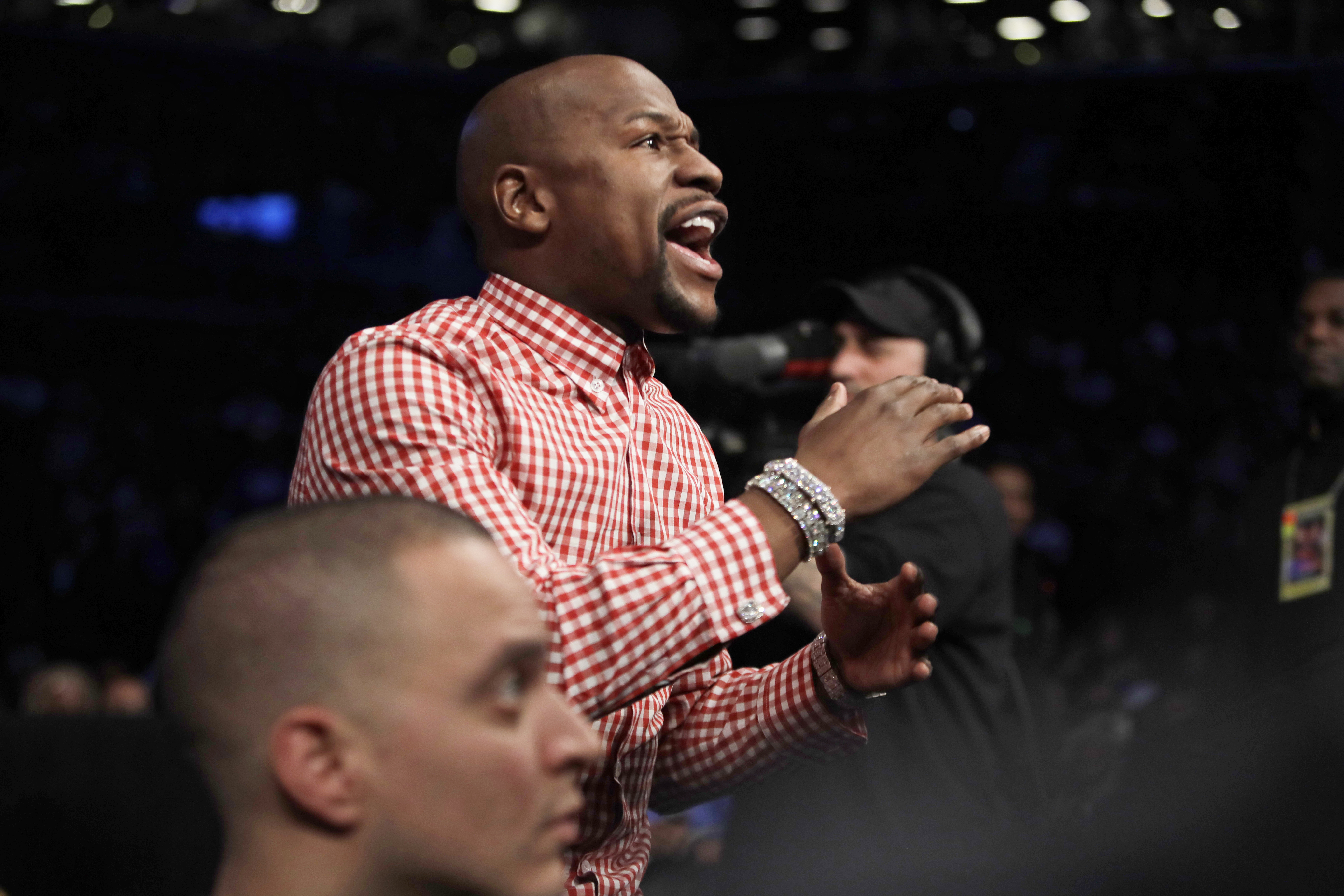 In this Jan 14, 2017, file photo, Floyd Mayweather Jr. reacts during the third round of a junior lightweight title fight between Jose Pedraza, of Puerto Rico, and Gervonta Davis in New York. (AP Photo/Frank Franklin II, File)