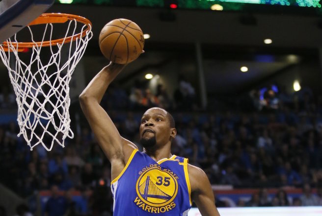 Golden State Warriors forward Kevin Durant (35) goes up for an unopposed dunk in the second quarter of an NBA basketball game against the Oklahoma City Thunder in Oklahoma City, Saturday, Feb. 11, 2017. (AP Photo/Sue Ogrocki)