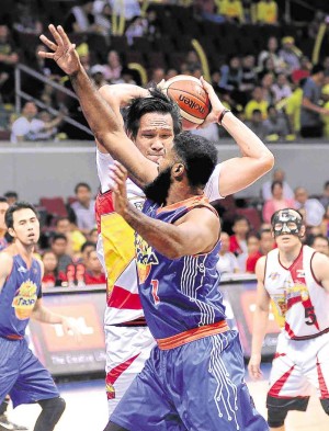 June Mar Fajardo of SMB protects the ball against  hard-nosed Moala Tautuaa of TNT in Game 7 of their Final Four series on Monday  at MoA Arena. —AUGUST DELA CRUZ