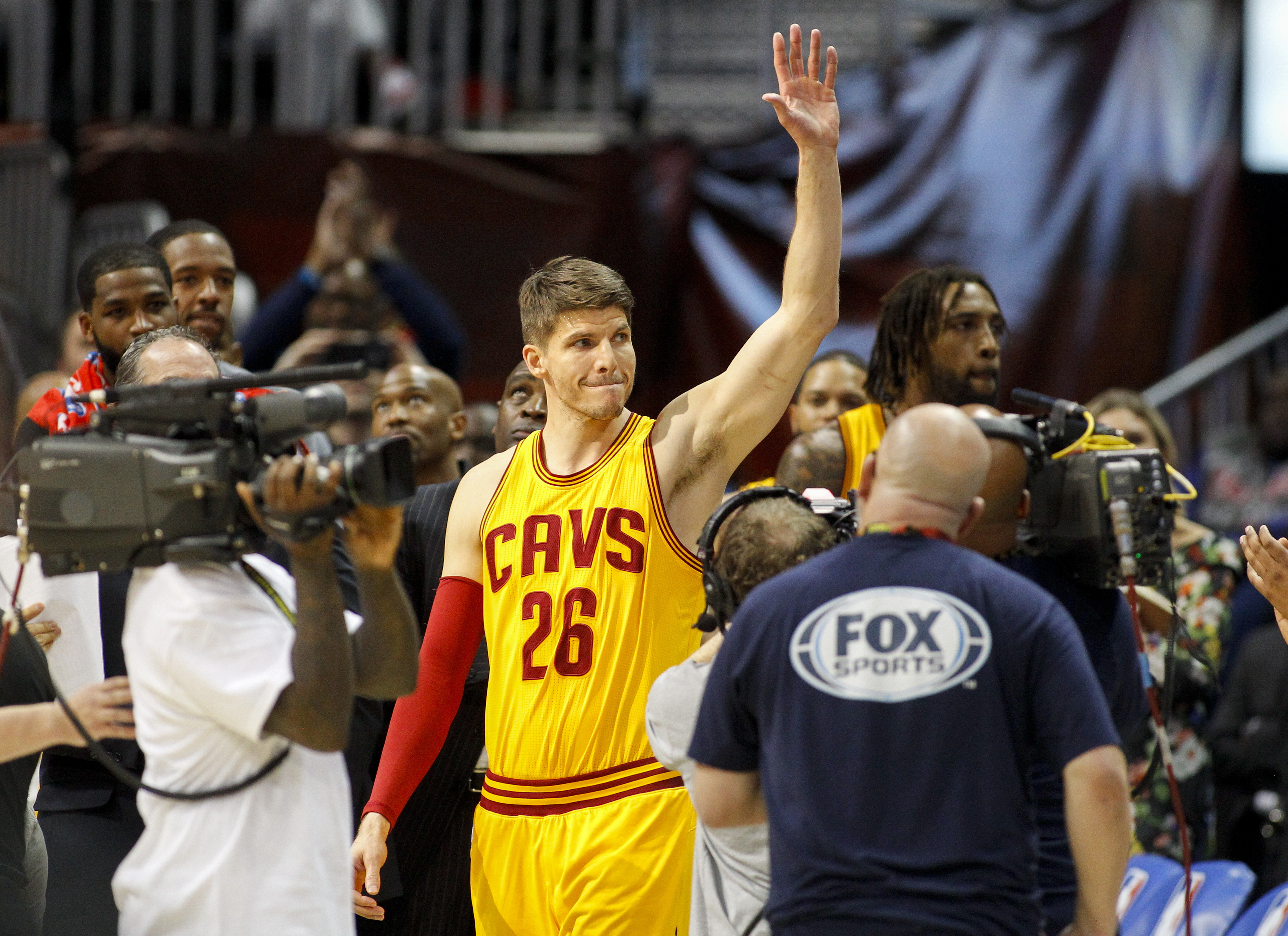Cleveland Cavaliers guard Kyle Korver (26) waves to the crowd after being honored in the first half of an NBA basketball game against the Atlanta Hawks, Friday, March 3, 2017, in Atlanta. (AP Photo/Brett Davis)