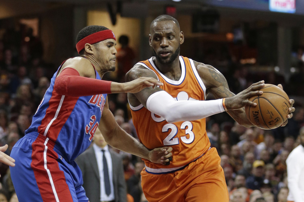 Cleveland Cavaliers' LeBron James (23) drives past Detroit Pistons' Tobias Harris (34) in the first half of an NBA basketball game, Tuesday, March 14, 2017, in Cleveland. (AP Photo/Tony Dejak)