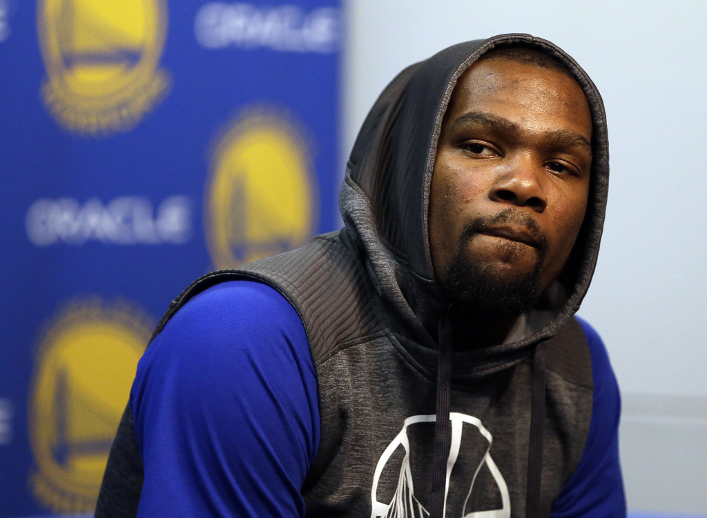 Golden State Warriors' Kevin Durant answers questions during a news conference prior to the team's NBA basketball game against the Boston Celtics on Wednesday, March 8, 2017, in Oakland, Calif. (AP Photo/Ben Margot)