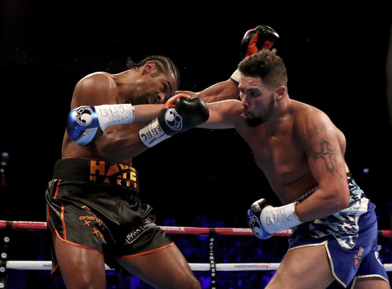 Tony Bellew, right, and David Haye in action during the heavyweight contest in London, Saturday March 4, 2017. (Nick Potts/PA via AP)