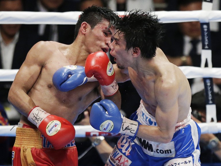 Marlon Tapales of the Philippine (L) and Shohei Omori of Japan (R) fight during their World Boxing Organisation (WBO) bantamweight title boxing bout in Osaka on April 23, 2017.Tapales has been stripped of his World Boxing Organization bantamweight title after failing to make the weight limit for the title defence against Japan's Shohei Omori in Osaka on April 23. 
