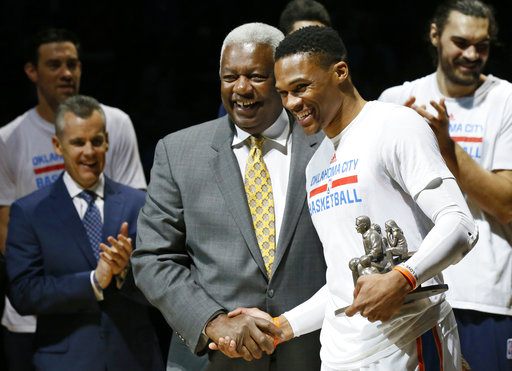 Oklahoma City Thunder guard Russell Westbrookk, right, is congratulated by Oscar Robertson on his triple-double record. AP