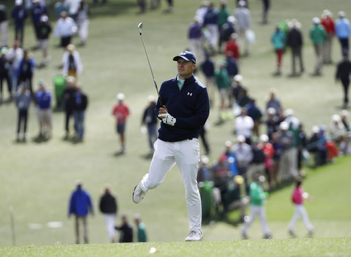 Jordan Spieth watches his shot on the first hole during the first round of the Masters golf tournament. AP