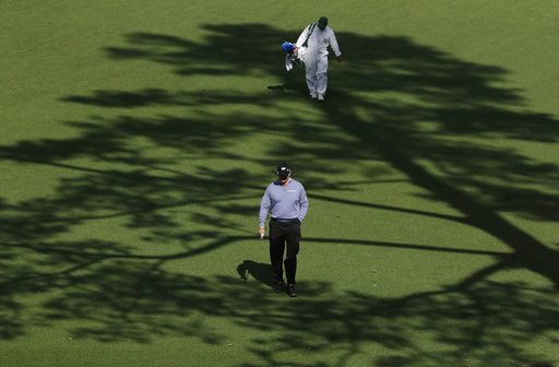 Ernie Els of South Africa, walks up the 15th fairway during the first round for the Masters golf tournament. AP