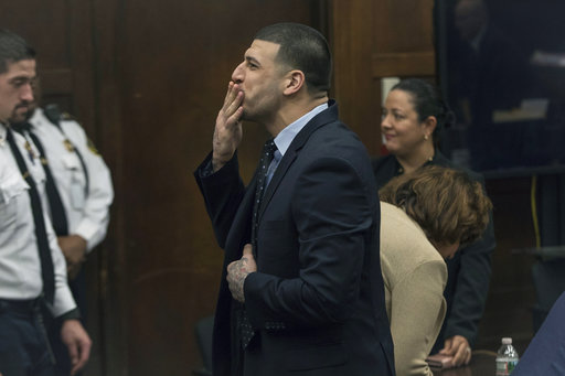 Former New England Patriots tight end Aaron Hernandez blows a kiss to his daughter, who sat with her mother, Shayanna Jenkins Hernandez, Hernandez's longtime fiancee, during jury deliberations in his double-murder trial at Suffolk Superior Court in Boston. AP