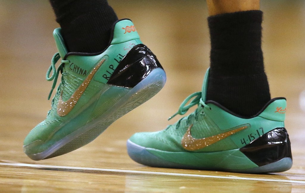 Boston Celtics' Isaiah Thomas wears a message on his shoes in memory of his sister Chyna during the fourth quarter of a first-round NBA playoff basketball game against the Chicago Bulls,Sunday, April 16, 2017, in Boston. The Bulls won 106-102. (AP Photo/Michael Dwyer)