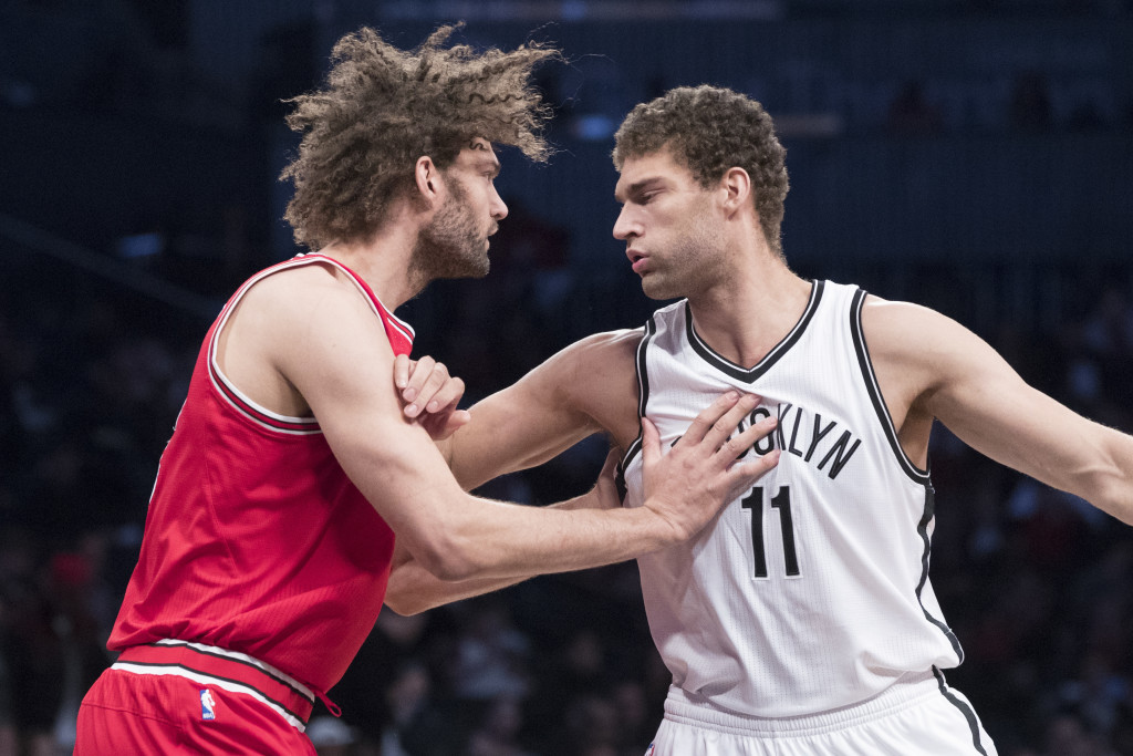 Chicago Bulls center Robin Lopez, left, guards his twin brother Brooklyn Nets center Brook Lopez (11) during the first half of an NBA basketball game, Saturday, April 8, 2017, in New York. (AP Photo/Mary Altaffer)