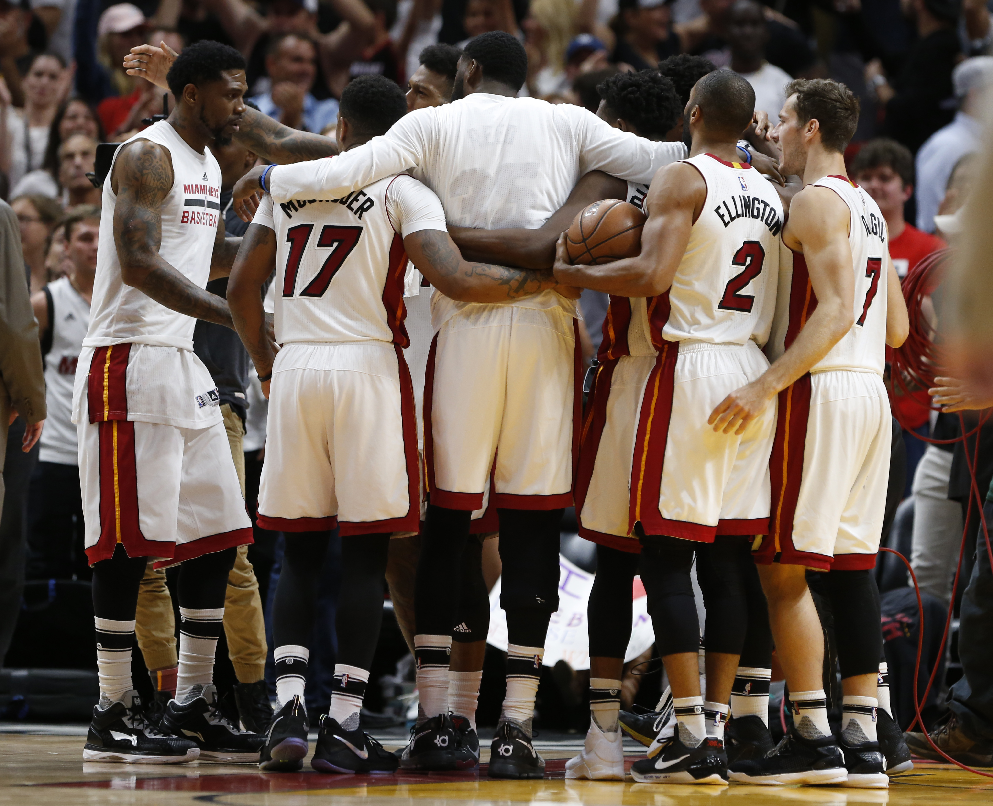 Miami Heat players celebrate after defeating the Cleveland Cavaliers 124-121 in overtime during an NBA basketball game, Monday, April 10, 2017, in Miami. (AP Photo/Wilfredo Lee)