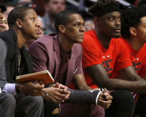 With a cast on his right thumb, Chicago Bulls' Rajon Rondo, center, sits on the bench during Game 3 of the team's NBA basketball first-round playoff series against the Boston Celtics in Chicago, Friday, April 21, 2017. (AP Photo/Charles Rex Arbogast)