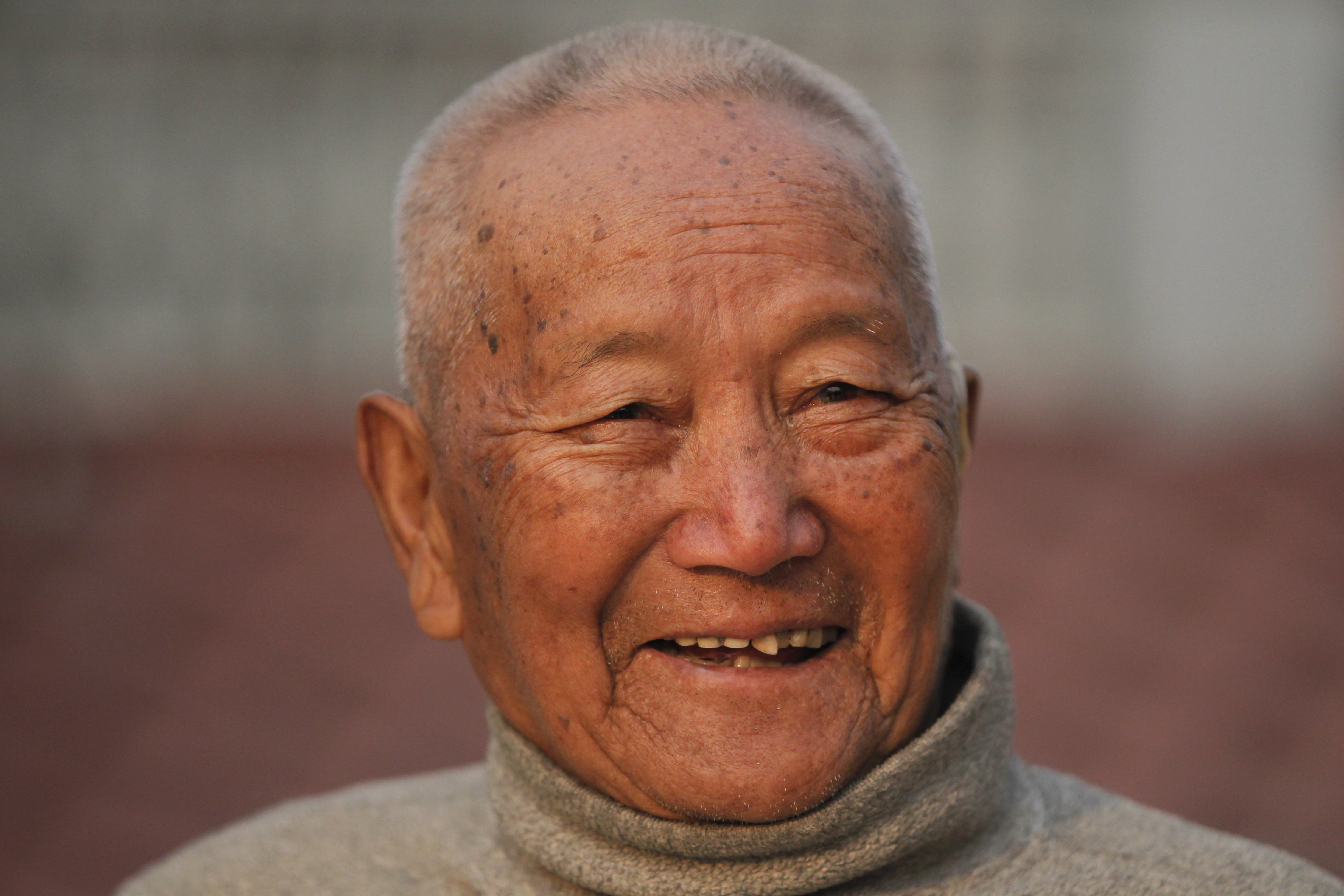 Nepalese mountain climber Min Bahadur Sherchan, smiles as he finishes his morning Yoga workout at his residence in Kathmandu, Nepal, Wednesday, April 12, 2017. The 85-year-old climber who was once the oldest person to scale the world’s highest mountain is heading back to Mount Everest in hopes of scaling the peak and regaining the title. Sherchan is aiming to scale the peak next month when there is window of favorable weather on the summit. (AP Photo/Niranjan Shrestha)