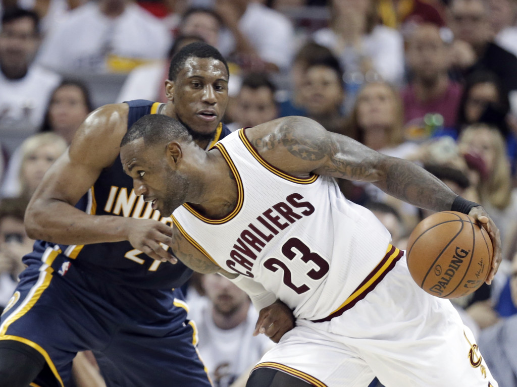 Cleveland Cavaliers' LeBron James (23) drives past Indiana Pacers' Thaddeus Young (21) in the second half in Game 1 of a first-round NBA basketball playoff series, Saturday, April 15, 2017, in Cleveland. The Cavaliers won 109-108. (AP Photo/Tony Dejak)