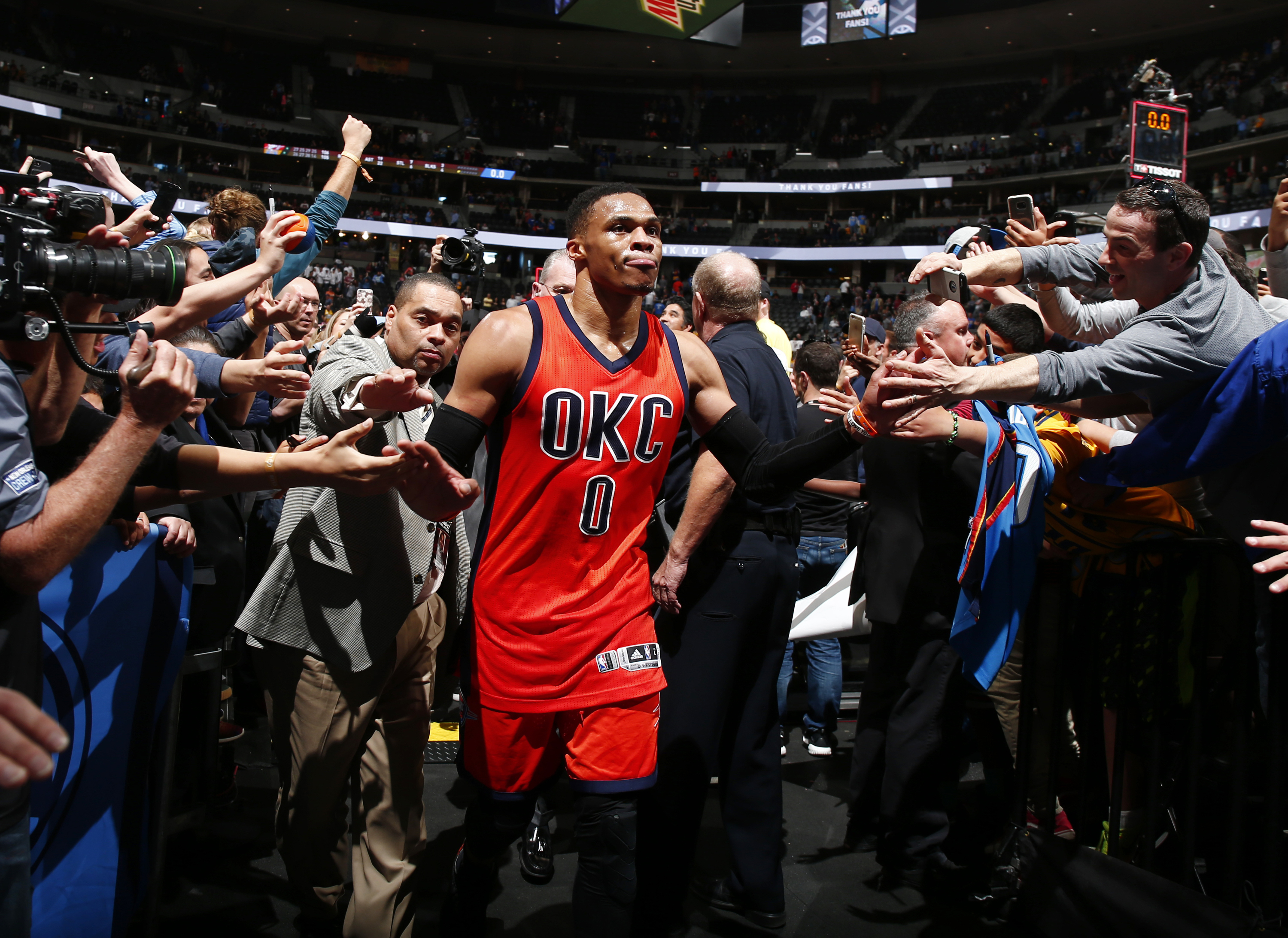 Oklahoma City Thunder guard Russell Westbrook celebrates after hitting a buzzer beating three point shot to win the game against the Denver Nuggets Sunday, April 9, 2017, in Denver. Oklahoma City defeated Denver 106-105. Westbrook also broke the NBA record for triple doubles with 42 for the season. (AP Photo/Jack Dempsey)
