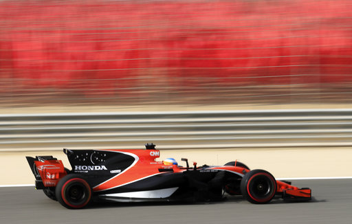 McLaren driver Fernando Alonso of Spain steers his car during the third practice session for the Bahrain Formula One Grand Prix, at the Formula One Bahrain International Circuit in Sakhir, Bahrain. AP