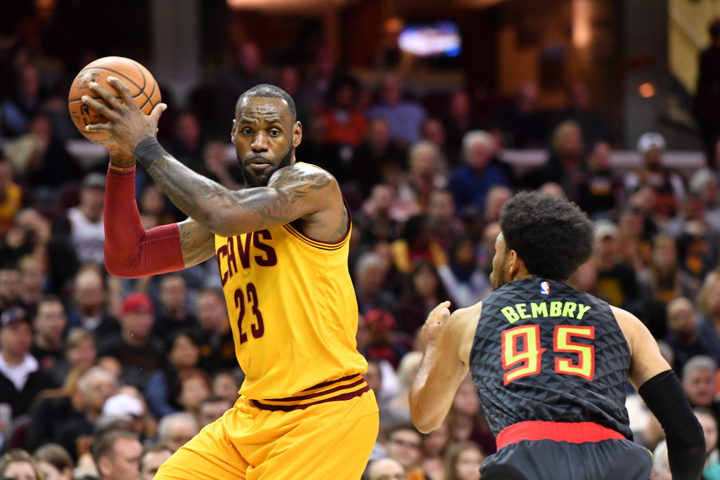 LeBron James #23 of the Cleveland Cavaliers looks for a pass while under pressure from DeAndre' Bembry #95 of the Atlanta Hawks during the first half at Quicken Loans Arena on April 7, 2017 in Cleveland, Ohio. AFP