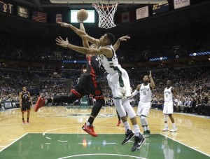 Toronto Raptors' DeMar DeRozan tries to shoot past Milwaukee Bucks' Giannis Antetokounmpo during the first half of Game 6 of an NBA first-round playoff series basketball game Thursday, April 27, 2017, in Milwaukee. (AP Photo/Morry Gash)