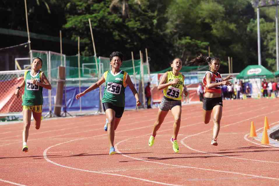 Bianca Jane Combate (259) of Eastern Visayas holds off her challengers in the finals of the Palarong Pambansa secondary girls’ 100-m dash. —TONEE DESPOJO/CEBU DAILY NEWS