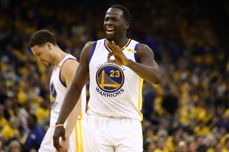 Draymond Green #23 of the Golden State Warriors reacts after a play against the San Antonio Spurs during Game Two of the NBA Western Conference Finals at ORACLE Arena on May 16, 2017 in Oakland, California. NOTE TO USER: User expressly acknowledges and agrees that, by downloading and or using this photograph, User is consenting to the terms and conditions of the Getty Images License Agreement.   Ezra Shaw/Getty Images/AFP