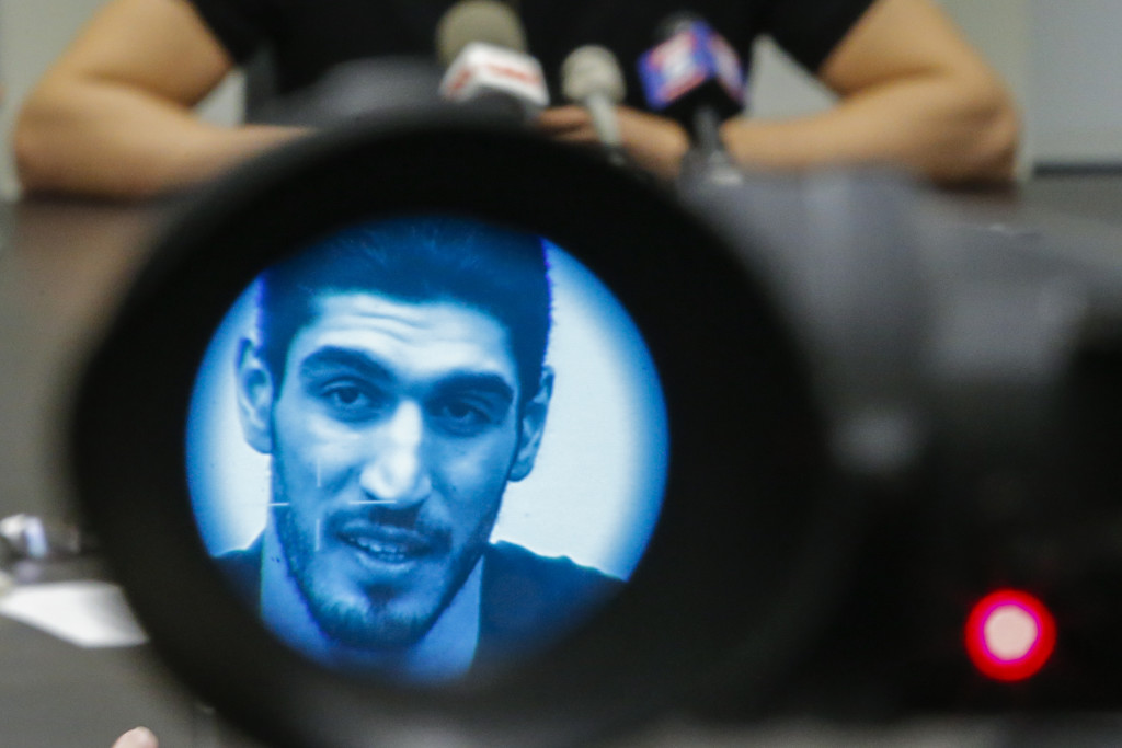 Turkish NBA Player Enes Kanter, seen through a video camera, speaks to the media during a news conference about his detention at a Romanian airport on May 22, 2017 in New York City. Kanter returned to the U.S. after being detained for several hours at a Romanian airport following statements he made criticizing Turkey's president Recep Tayyip Erdogan.   Eduardo Munoz Alvarez/Getty Images/AFP