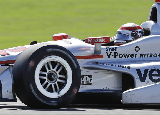 Will Power, of Australia, drives during the Grand Prix of Indianapolis IndyCar auto race at Indianapolis Motor Speedway. AP