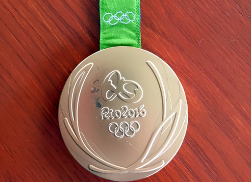 This photo provided by Kevin Snyder show Kyle Snyder's damaged gold metal from the 2016 Rio Olympics. The medal will soon replaced by the IOC and Rio organizers because of damage. Snyder and Helen Maroulis, another U.S. gold medalist wrestler, are among a group of more than 100 athletes from around the world with defective Olympic medals. AP