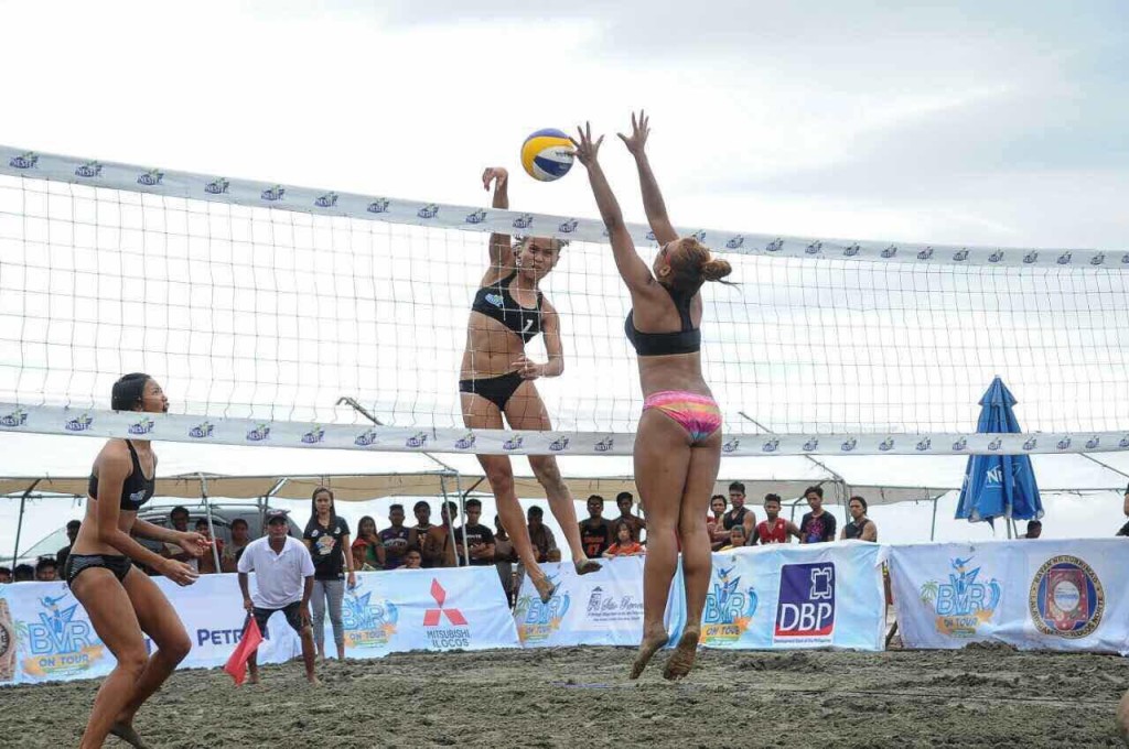 UST's Cherry Rondina gets one over San Beda's defense in the Beach Volleyball Republic. Contributed Photo.
